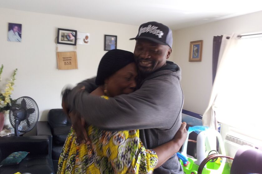 Charly Leundeu Keunang, 43, a Cameroonian national, hugs his mother, Heleine Tchayou, in 2014. Keunang was shot and killed by LAPD in the skid row area of Los Angeles on March 1, 2015.