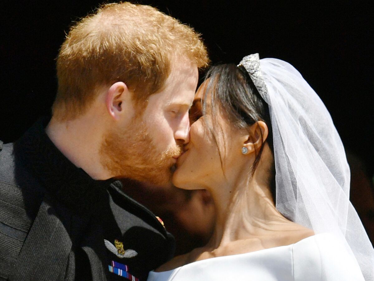 Prince Harry and Meghan Markle kiss on the steps of St. George's Chapel in Windsor Castle after their wedding