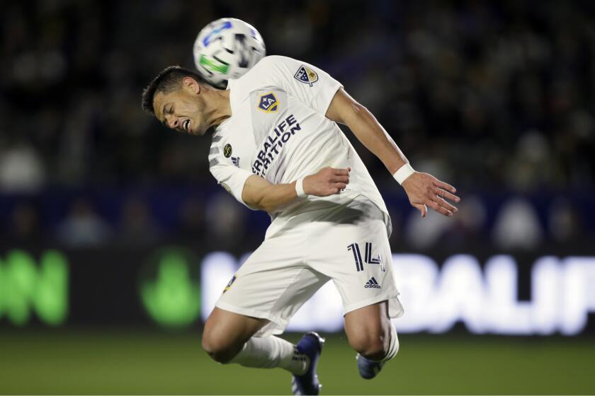 LA Galaxy forward Javier Hernandez heads the ball behind him during the second half of an MLS soccer match against the Vancouver Whitecaps in Carson, Calif., Saturday, March 7, 2020. (AP Photo/Alex Gallardo)