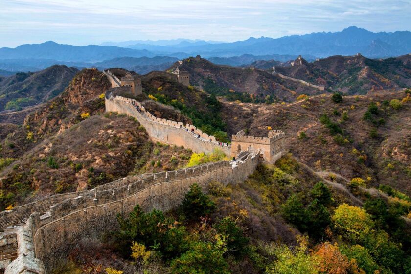 The view from the Great Wall's Jinshanling section extends as far as 10 or 15 miles on a clear day, to the mountains in the distance where the Gubeikou segment rises.