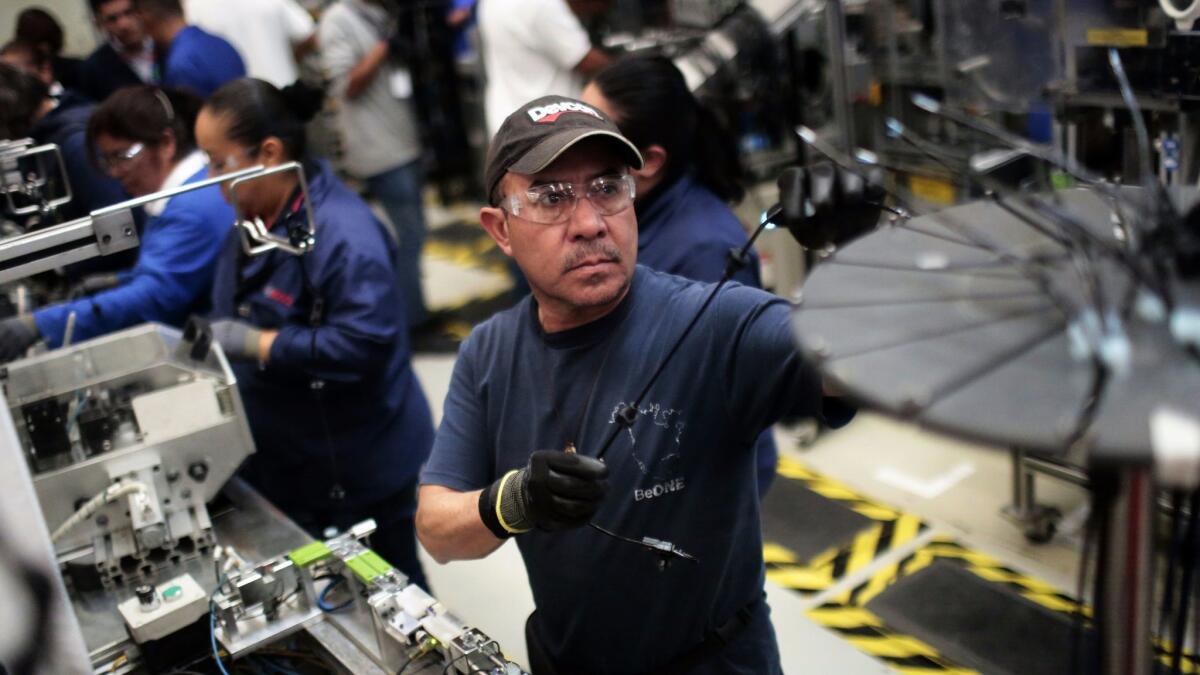 A worker in the auto parts production line at the Bosch factory in San Luis Potosi, Mexico.