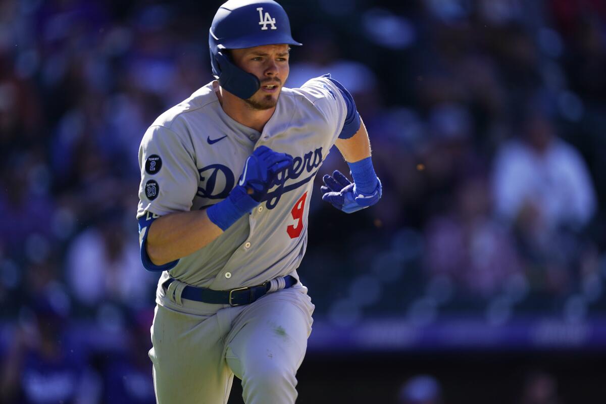 Dodgers second baseman Gavin Lux runs to first during the team's season opener.
