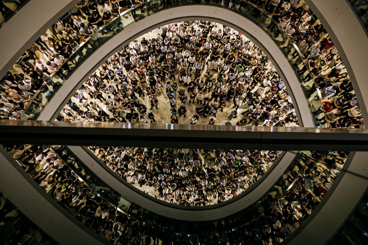 People gather for chants and a singalong at the IFC Mall in Hong Kong.