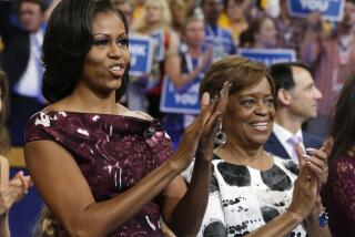 FILE - First lady Michelle Obama, left, and her mother Marian Robinson react as Ret. Navy Admiral John B. Nathman speaks to delegates at the Democratic National Convention in Charlotte, N.C., Sept. 6, 2012. Robinson, who moved with the first family to the White House when son-in-law Barack Obama was elected president, has died, according to an announcement by Michelle Obama and other family members Friday, May 31, 2024. (AP Photo/Charles Dharapak, File)