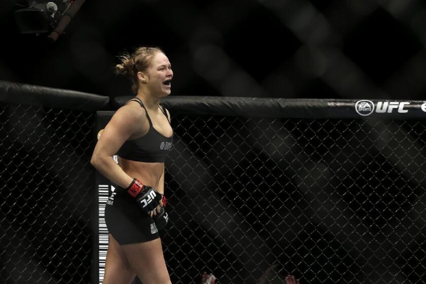 Ronda Rousey reacts after defeating Sara McMann on Saturday.