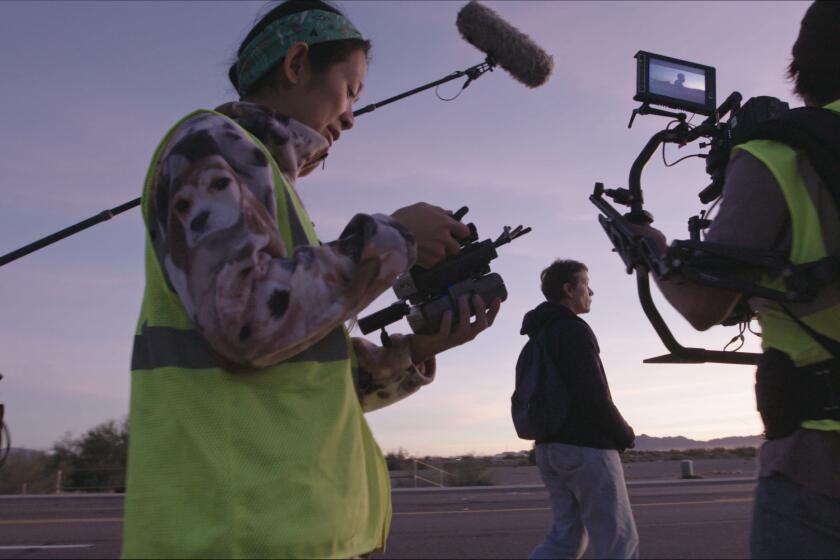 Director/Writer Chloe Zhao and Frances McDormand on the set of NOMADLAND. Photo Courtesy of Searchlight Pictures. ? 2020 20th Century Studios All Rights Reserved