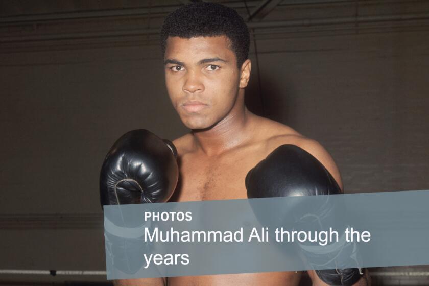 World heavyweight boxing champion Muhammad Ali poses at the Royal Artillery Gymnasium in London while training for a 1966 fight against British champion Henry Cooper. Ali, who compiled a 56-5 professional record, is considered one of the greatest boxers of all-time.