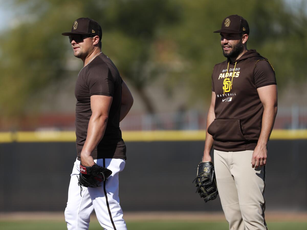 Former Padres' teammates Luke Voit, left, and Eric Hosmer work out March 22 during spring training in Peoria, Ariz.
