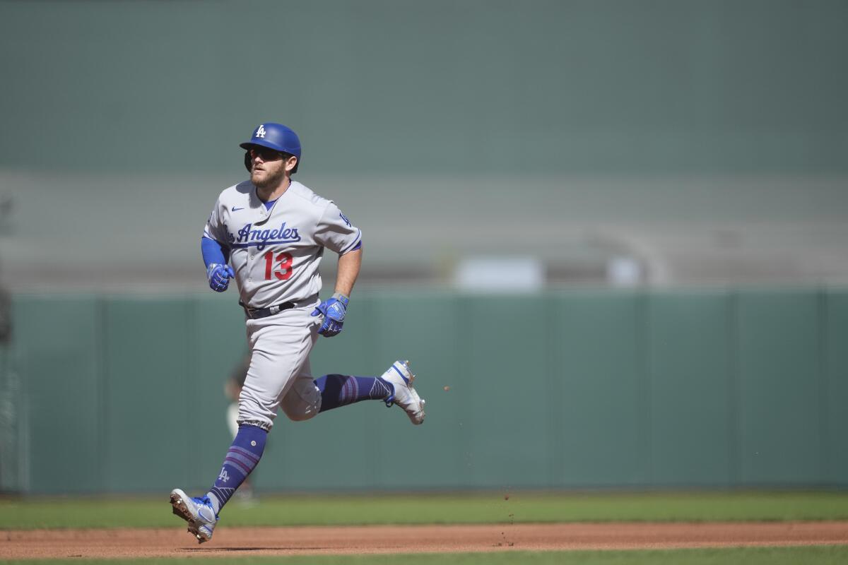 Dodgers second baseman Max Muncy runs the bases after hitting a home run.