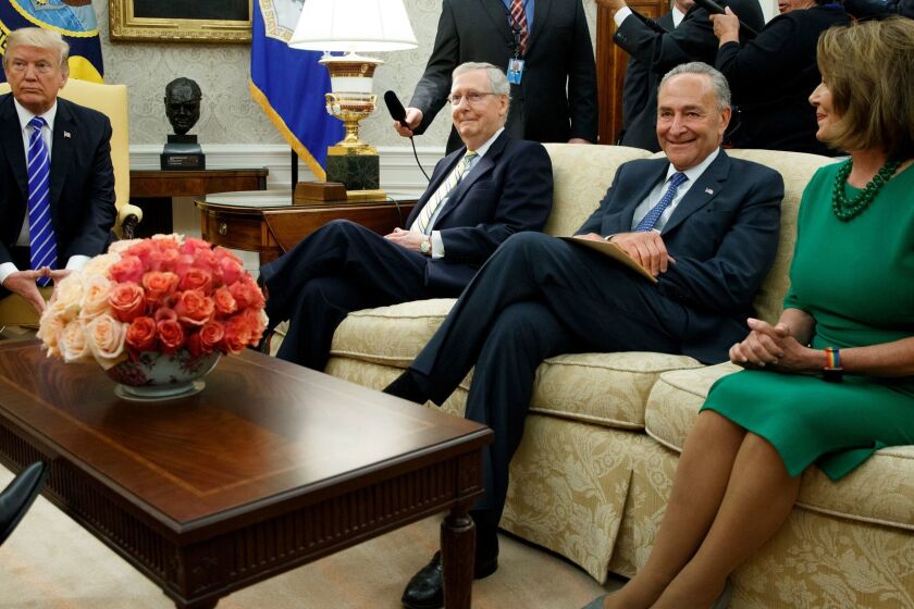 President Donald Trump pauses during a meeting with, from left, Senate Majority Leader Mitch McConnell, R-Ky., Senate Minority Leader Chuck Schumer, D-N.Y., House Minority Leader Nancy Pelosi, D-Calif., and other Congressional leaders in the Oval Office of the White House, Wednesday, Sept. 6, 2017, in Washington. Trump overruled congressional Republicans and his own treasury secretary Wednesday and cut a deal with Democrats to fund the government and raise the federal borrowing limit for three months, all part of an agreement to speed money to Harvey relief. (AP Photo/Evan Vucci)
