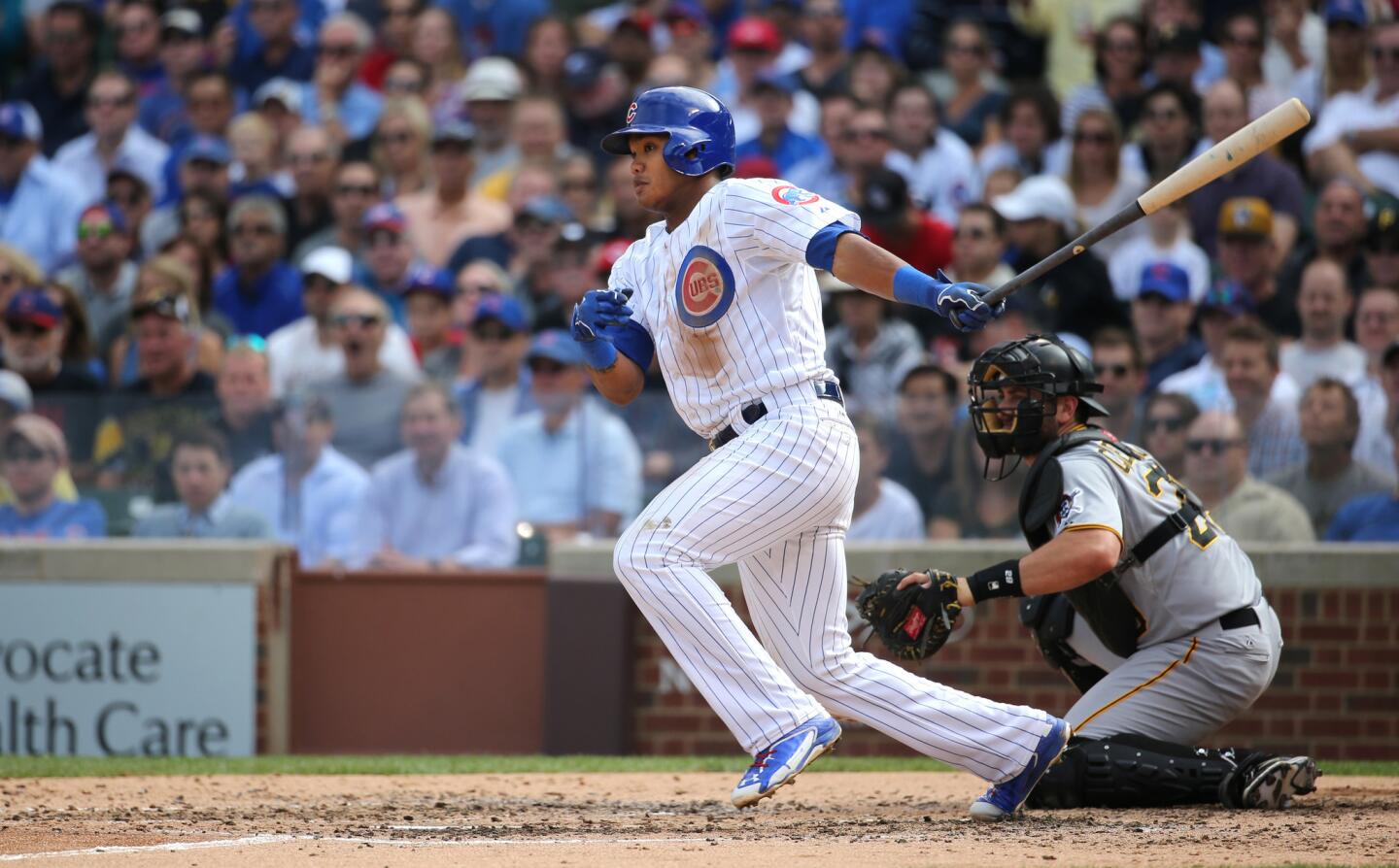 Cubs batter Addison Russell hits into a fielder's choice in the fourth inning. Kris Bryant scored on the play.