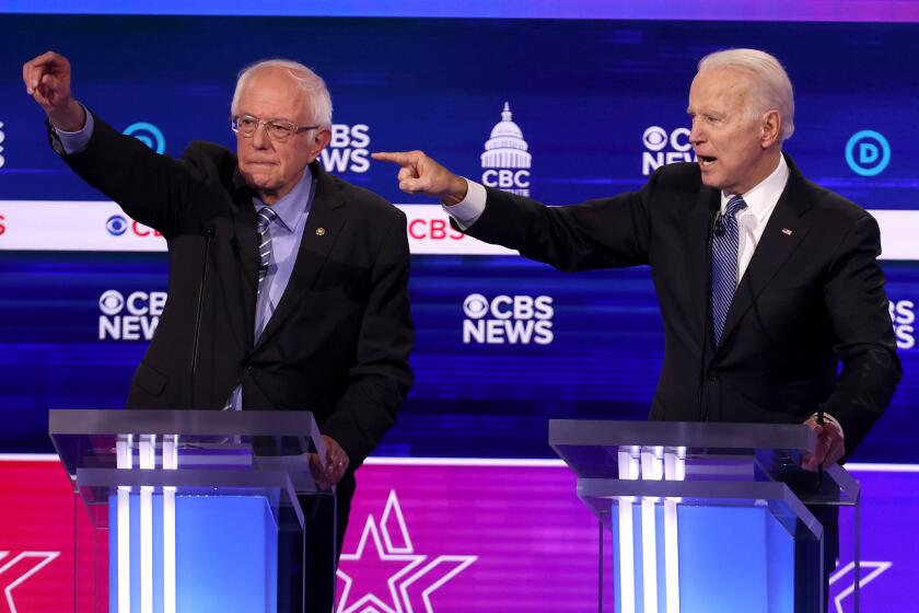 CHARLESTON, SOUTH CAROLINA - FEBRUARY 25: Democratic presidential candidate former Vice President Joe Biden speaks as Sen. Bernie Sanders (I-VT) (L) loo during the Democratic presidential primary debate at the Charleston Gaillard Center on February 25, 2020 in Charleston, South Carolina. Seven candidates qualified for the debate, hosted by CBS News and Congressional Black Caucus Institute, ahead of South Carolina’s primary in four days. (Photo by Win McNamee/Getty Images)
