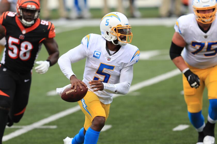 Los Angeles Chargers quarterback Tyrod Taylor (5) runs during the first half of an NFL football game.