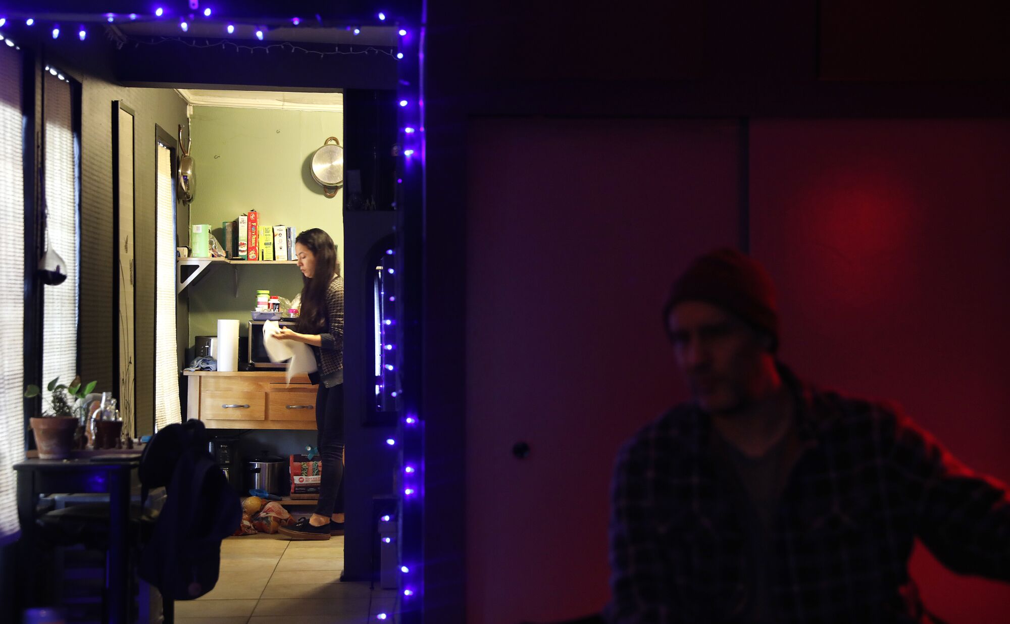 Jenna Loredo, left, shares an apartment with her boyfriend, Rory Anglin, and their dog.