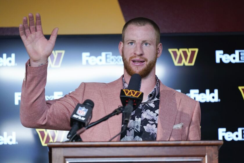 Washington Commanders quarterback Carson Wentz (11) gesturing during his news conference after and an NFL football game against the Philadelphia Eagles, Sunday, Sept. 25, 2022, in Landover, Md. Eagles won 24-8. (AP Photo/Alex Brandon)