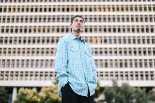 Los Angeles, CA - November 06: Adrian Abelar, who was shot by L.A. sheriff's deputies in 2021 in questionable circumstances, poses for a portrait at Grand Park on Monday, Nov. 6, 2023 in Los Angeles, CA. (Dania Maxwell / Los Angeles Times)