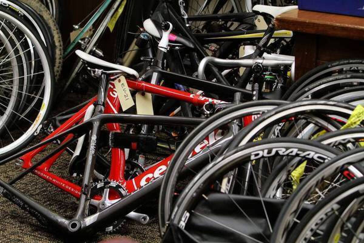 Sheriff's investigators display some of the recovered racing bicycles that were stolen from victims found through Facebook and Craigslist.