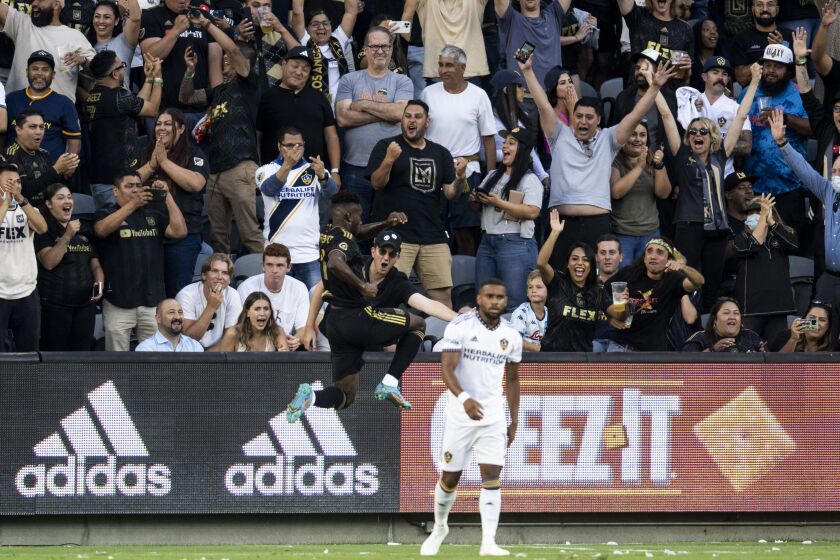 LAFC midfielder José Cifuentes goes airborne to celebrate his first-half goal against the Galaxy on July 8, 2022.