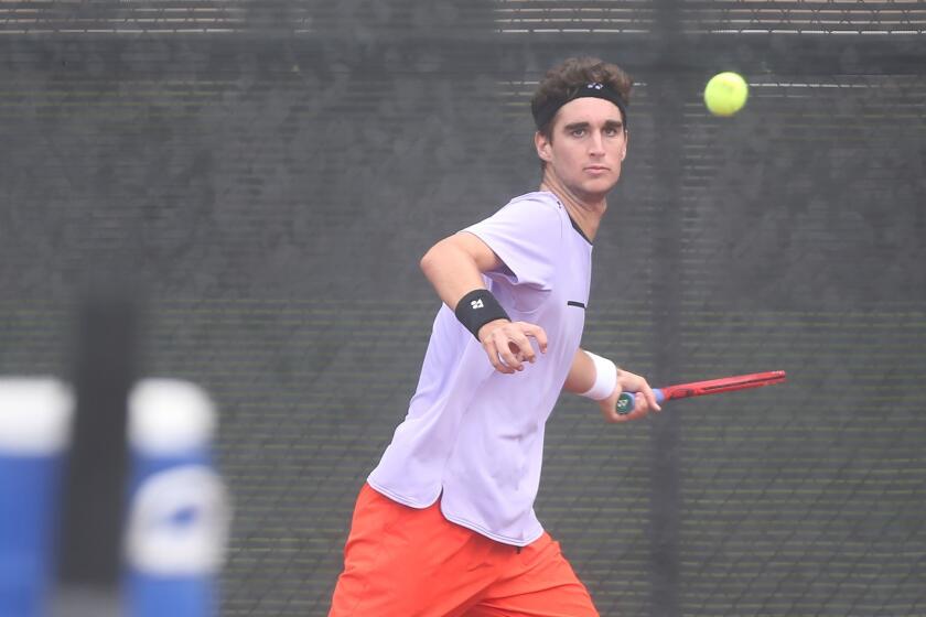 Number one seed Max McKennon eyes a forehand in match against opponent Tyler Davis, in the boysâ 18-and-under singles round of 16 at the USTA Southern California Junior Sectional Championships at Costa Mesa Tennis Center on Friday.
