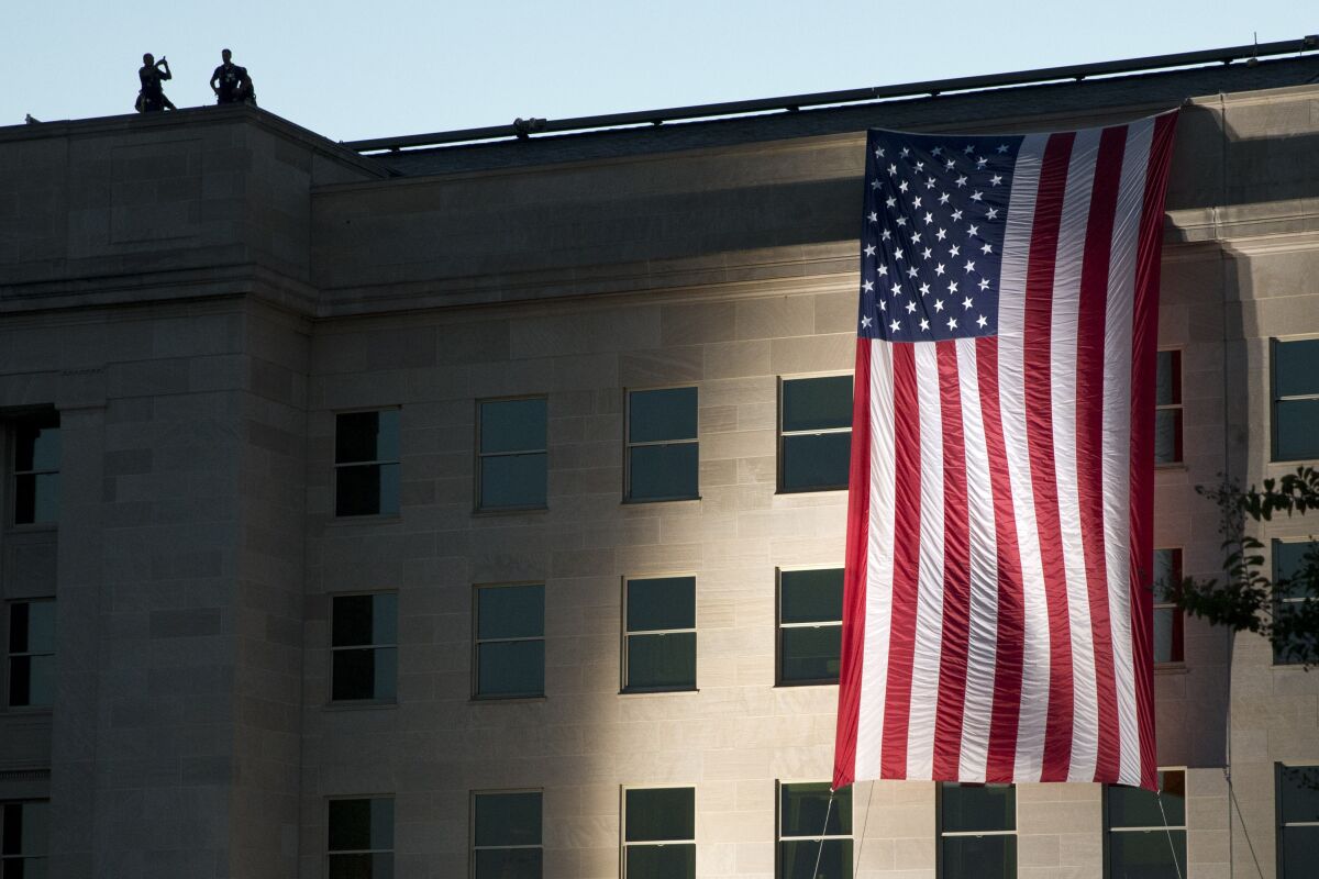American flag is draped on the side of the Pentagon