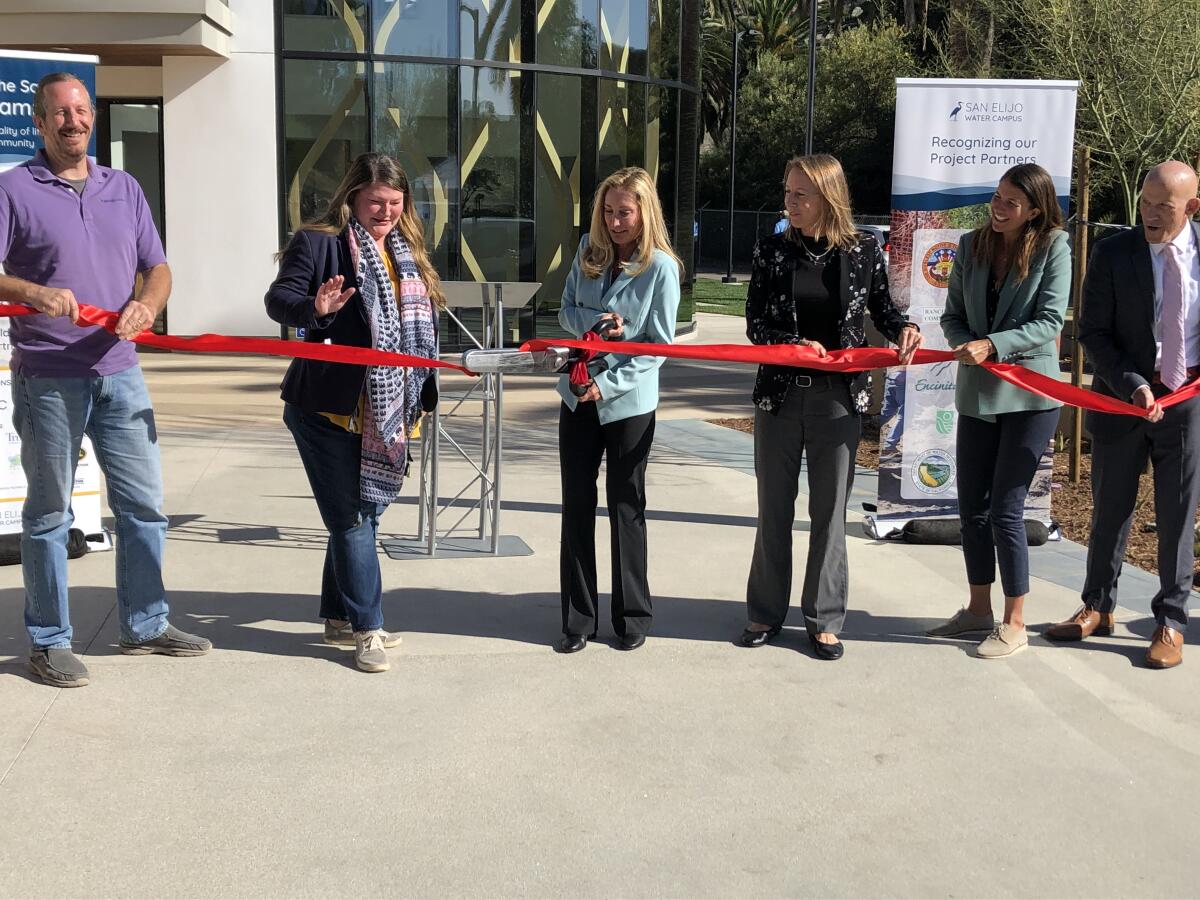 Local officials cut the ribbon to open the new facility.