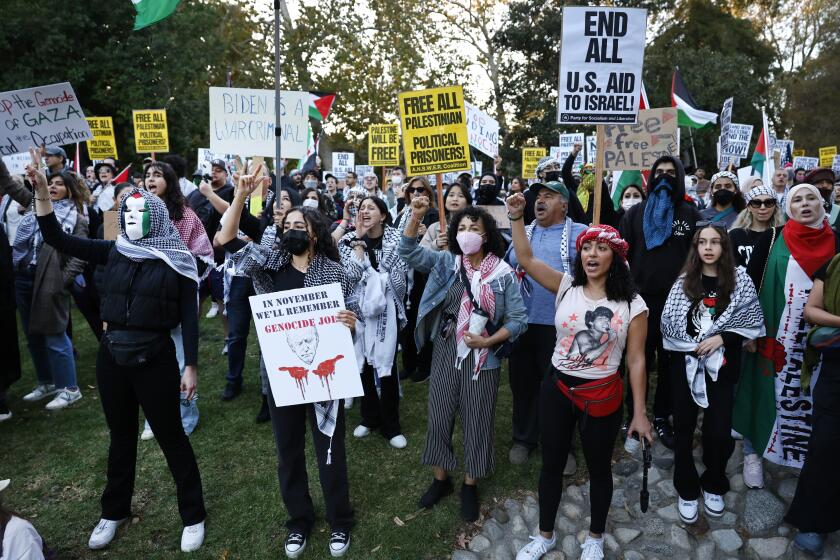 LOS ANGELES, CA - DECEMBER 08: Members of Palestinian Youth Movement, PSL-LA, and others gather on Friday, December 8, 2023, at Holmby Park to protest President Biden's fundraising visit to Los Angeles. The coalition calls for an immediate end to the ongoing humanitarian crisis in Gaza. (Gina Ferazzi / Los Angeles Times)