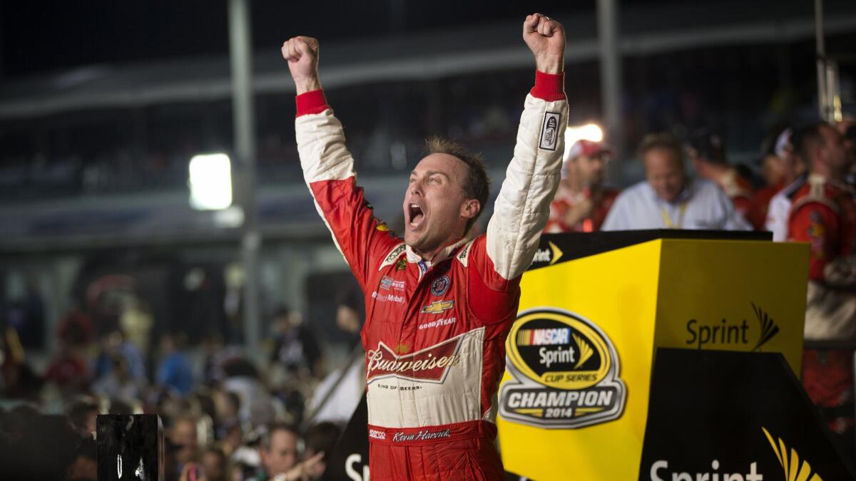 Kevin Harvick celebrates after winning the NASCAR Sprint Cup championship at Homestead-Miami Speedway on Sunday.