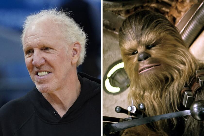 Bill Walton is on the left and Chewbacca is on the right.
