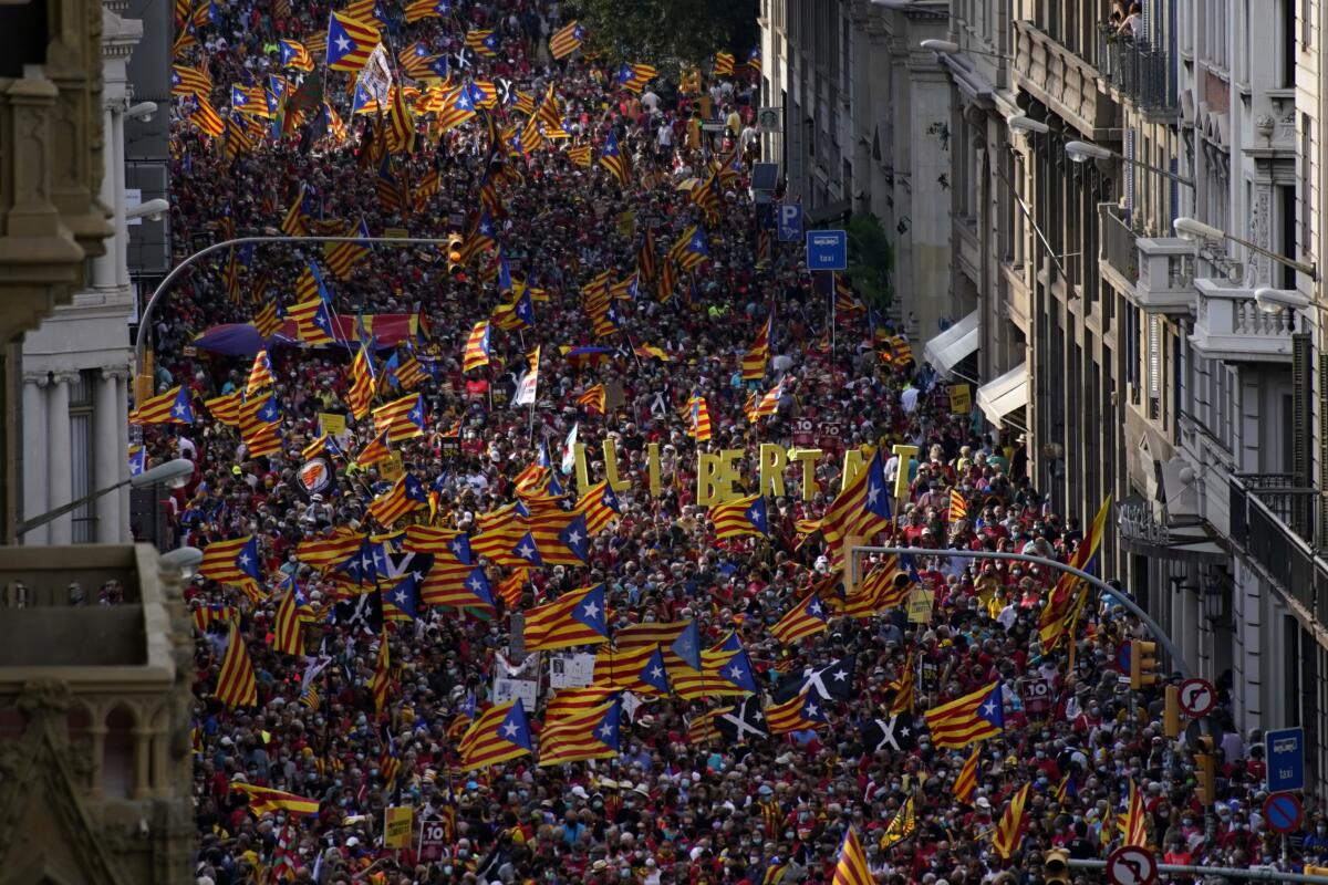 Demonstrators march during the Catalan National Day in Barcelona, Spain, on Saturday.