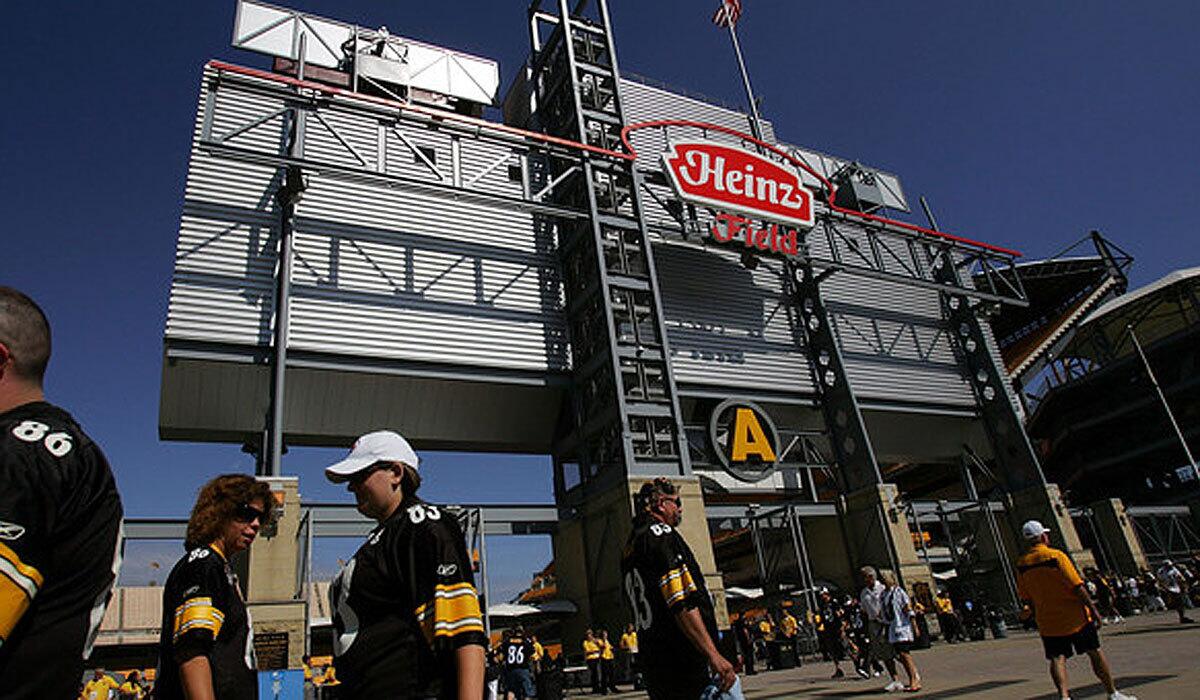 Fans walk to Heinz Field in Pittsburgh before a game between the Steelers and Houston Texans in 2008.