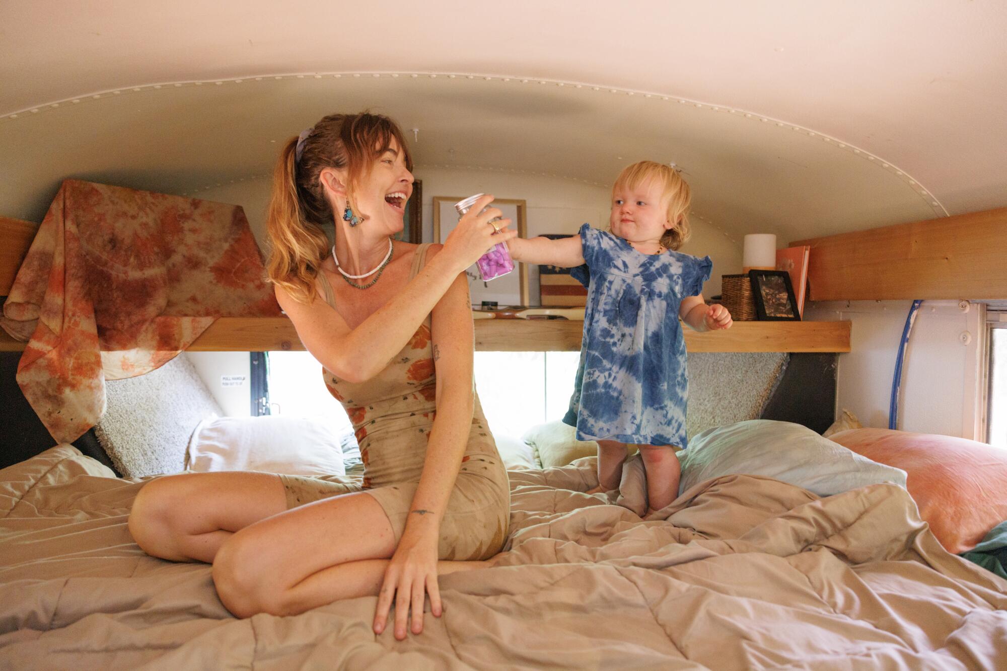 Laura La Rue in bed with her 16-month-old daughter Lasca