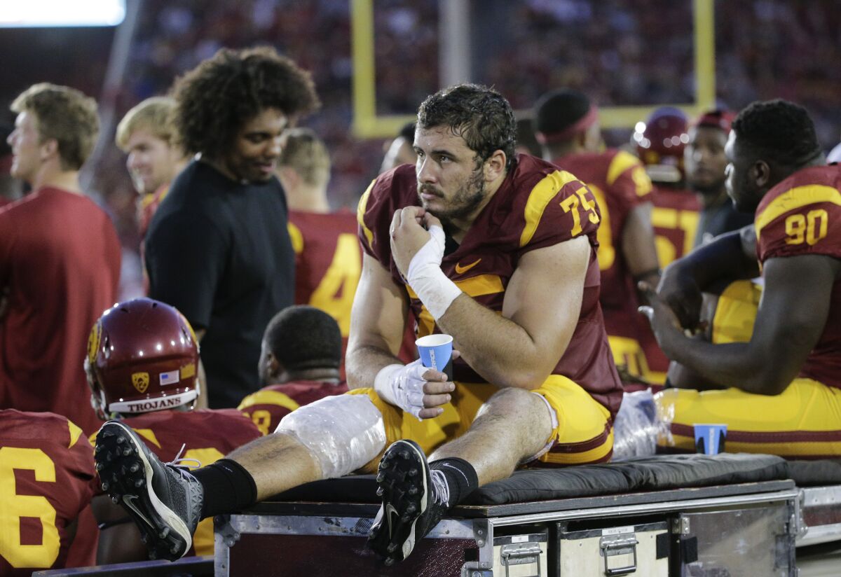USC center Max Tuerk sits on the sidelines during a game against Washington in October 2015.
