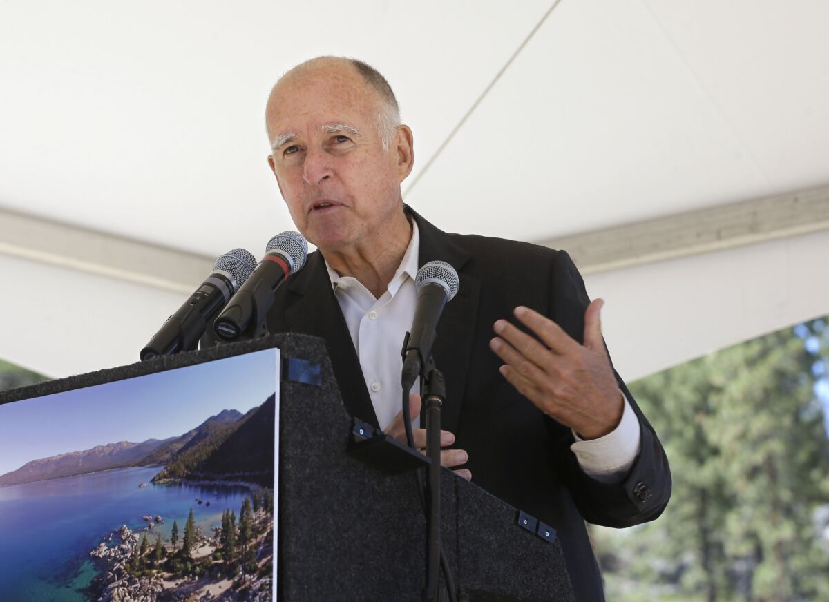 Gov. Jerry Brown speaks during a conference at Lake Tahoe, Nev., on Monday. He's been pushing legislation to reduce gasoline use, arousing oil industry opposition.