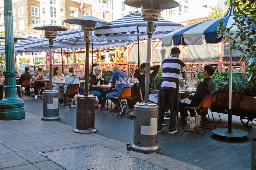 Customers dine outdoors at Ironside Fish and Oyster at Little Italy last October.