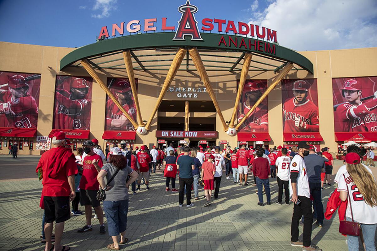 Fans line up to enter Angel Stadium.