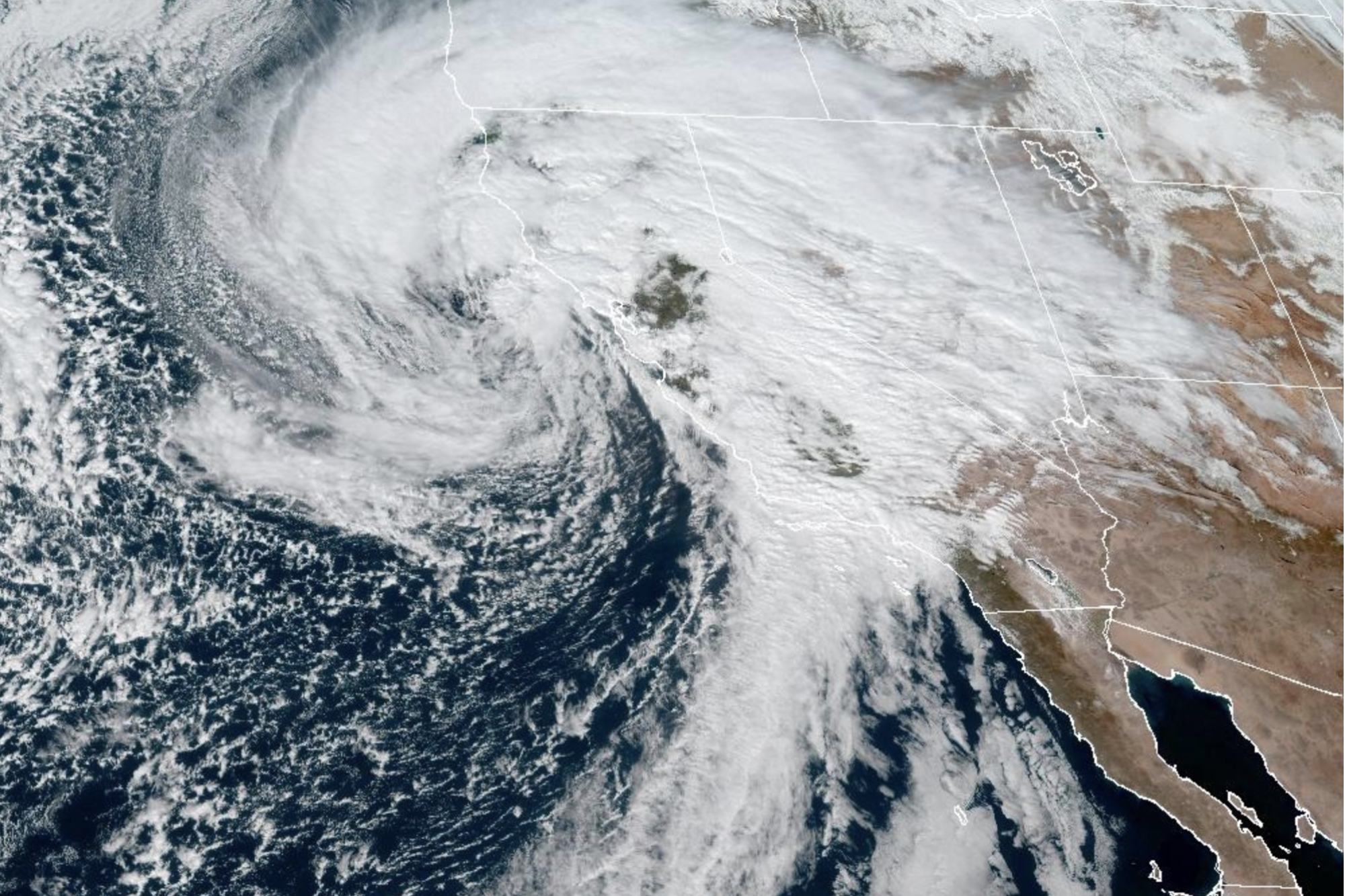 A satellite image shows a powerful storm over California.