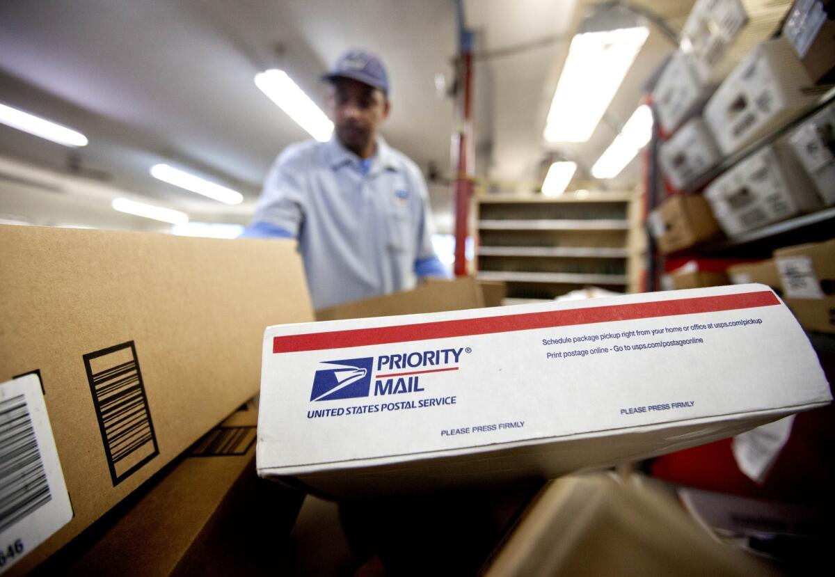 The U.S. Postal Service on Friday reported its seventh-straight net yearly loss. The agency said it lost $5 billion in the last fiscal year in spite of improved revenue and productivity. Above, packages wait to be sorted in Atlanta in February.