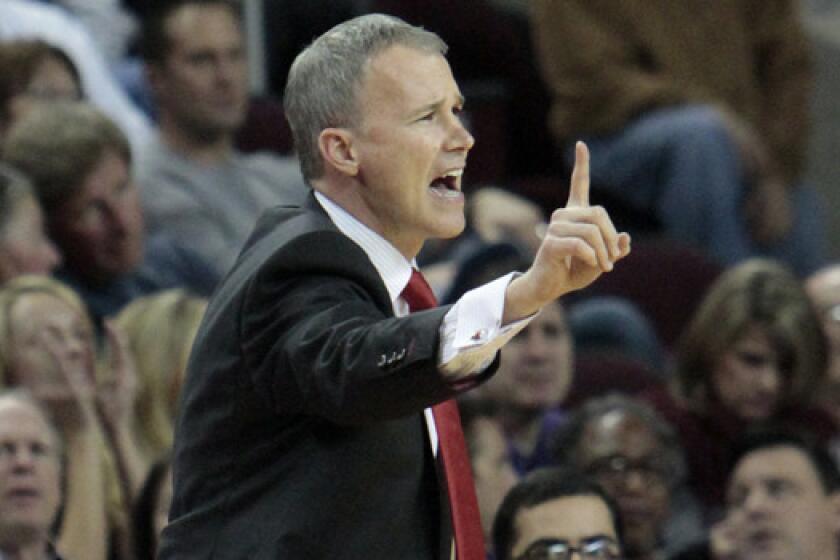 USC Coach Andy Enfield instructs his players during the first half of Wednesday's win over California at the Galen Center.