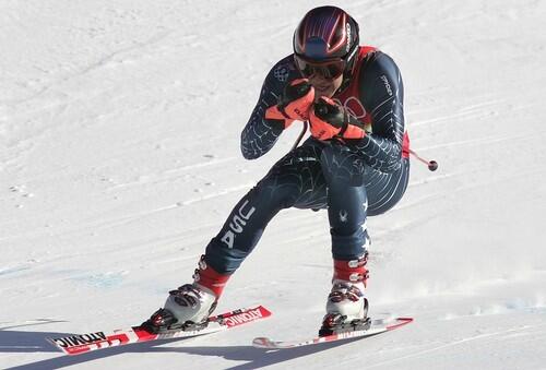 Bode Miller of the United States speeds down th course during the Men's Downhill.