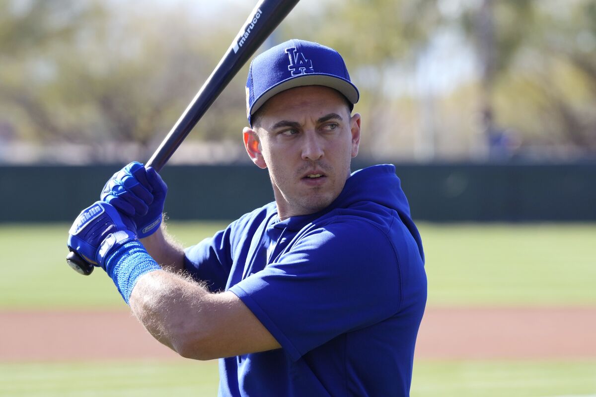 Los Angeles Dodgers' Austin Barnes holds up his bat.