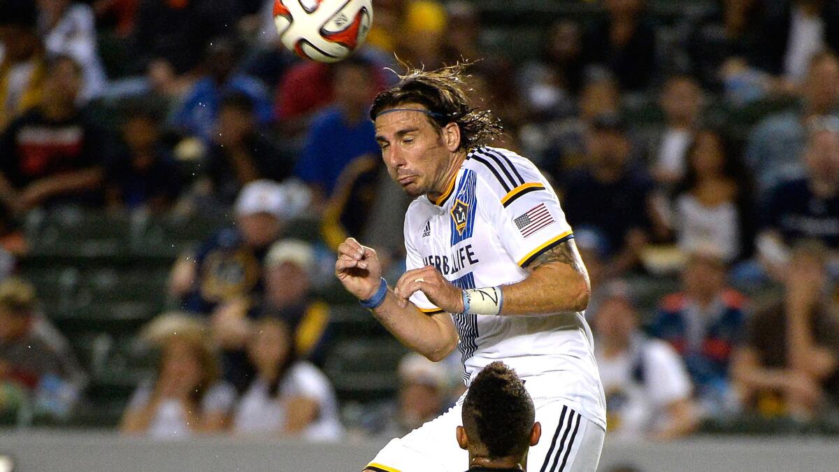 Galaxy forward Alan Gordon heads the ball in the second half of a win over D.C. United in 2014.