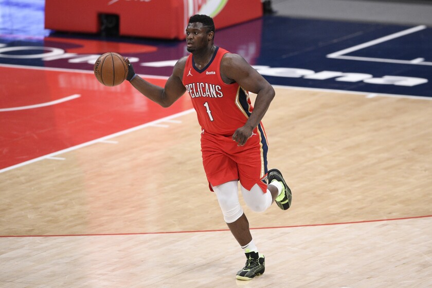 Zion Williamson dribbles the ball during a game against the Washington Wizards.