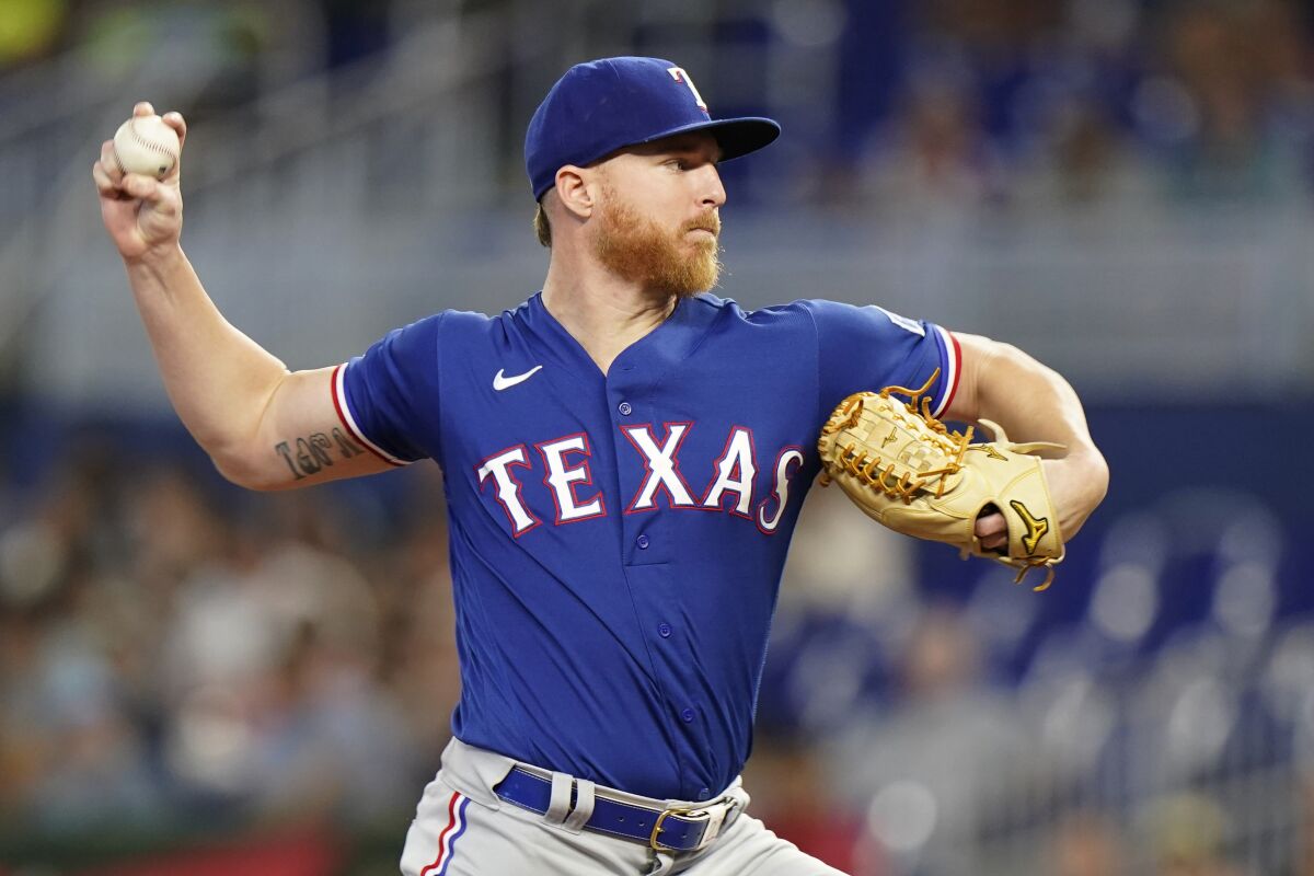 Texas Rangers' Jon Gray delivers a pitch during the first inning of a baseball game against the Miami Marlins, Thursday, July 21, 2022, in Miami. (AP Photo/Wilfredo Lee)