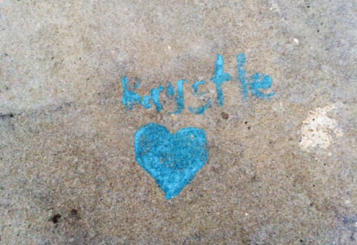 The site where Krystle Campbell died at the 2013 Boston Marathon is marked by a small heart and her name.