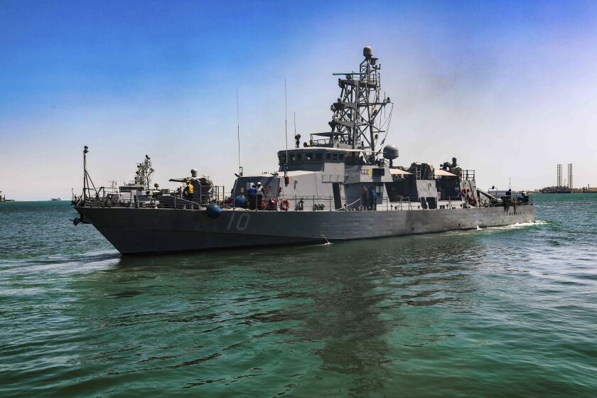 FILE - This April 14, 2020, file photo provided by the U.S. Army shows the USS Firebolt in Manama, Bahrain. The Firebolt fired warning shots when vessels of Iran's paramilitary Revolutionary Guard came too close to a recent patrol in the Persian Gulf, the U.S. Navy said Wednesday, April 28, 2021. (Spc. Cody Rich/U.S. Army via AP)
