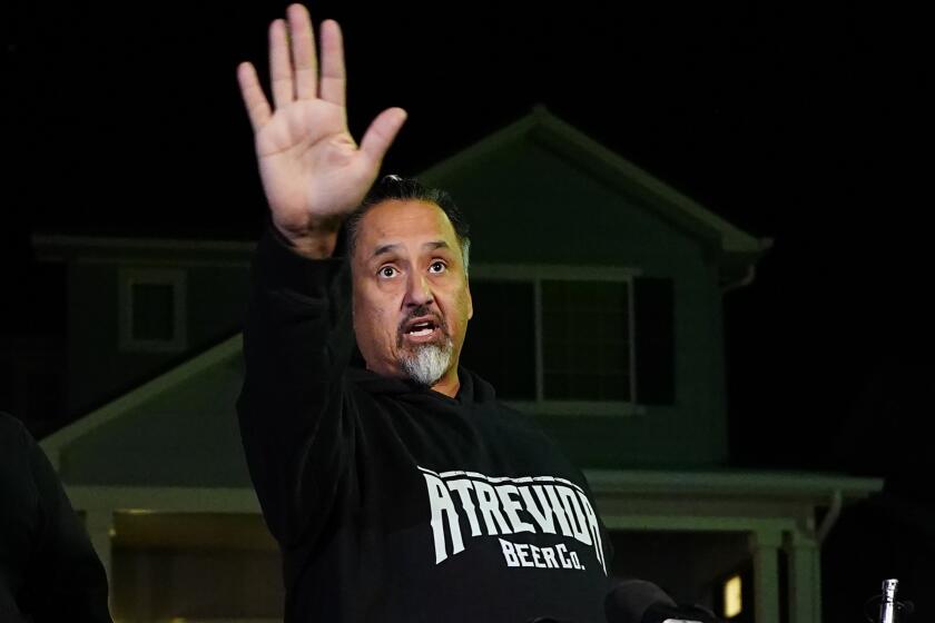 Richard Fierro gestures while speaking during a news conference outside his home about his efforts to subdue the gunman in Saturday's shooting at Club Q, Monday, Nov. 21, 2022, in Colorado Springs, Colo. (AP Photo/Jack Dempsey)