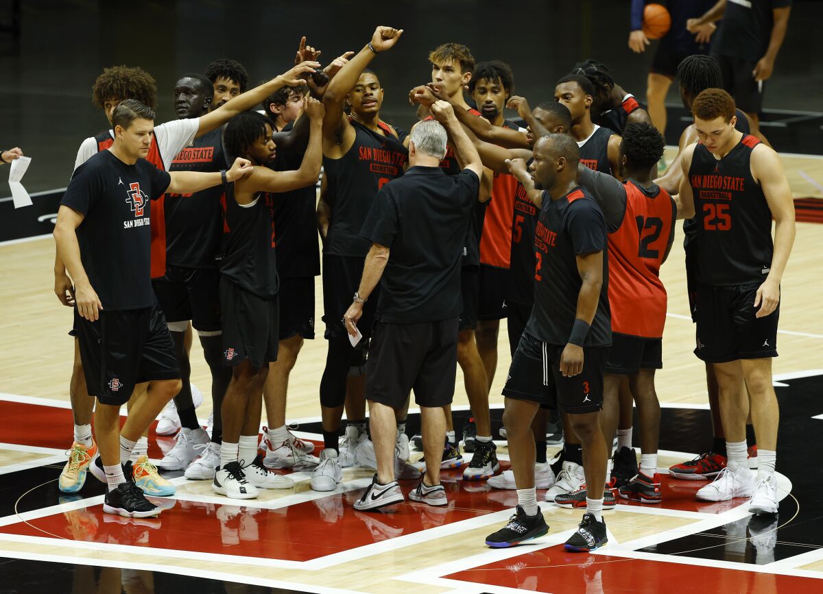 SDSU coach Brian Dutcher talks with his team during practice at Viejas Arena on Monday.