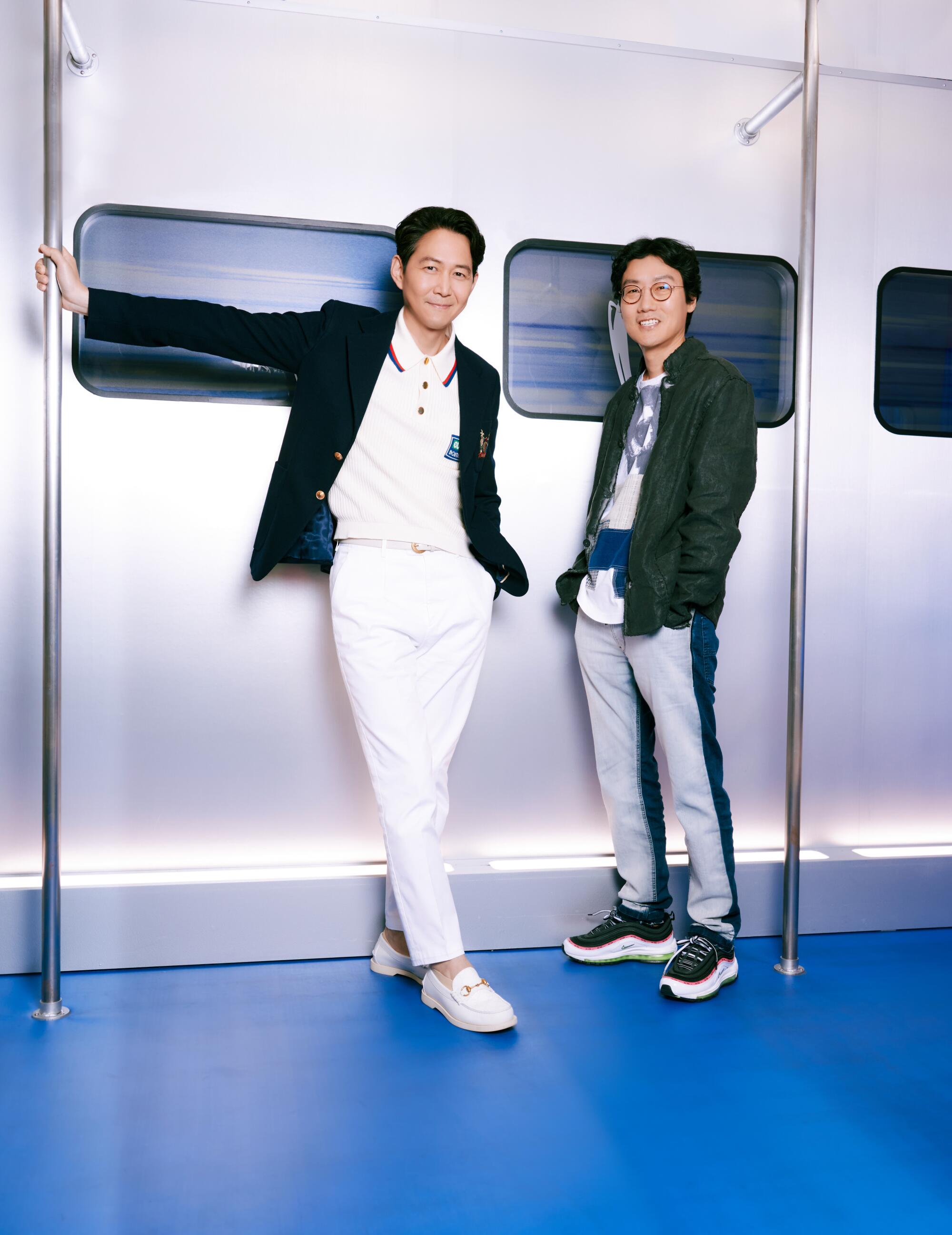 "Squid Game"  creator Hwang Dong-hyuk and actor Lee Jung-jae pose for a portrait.