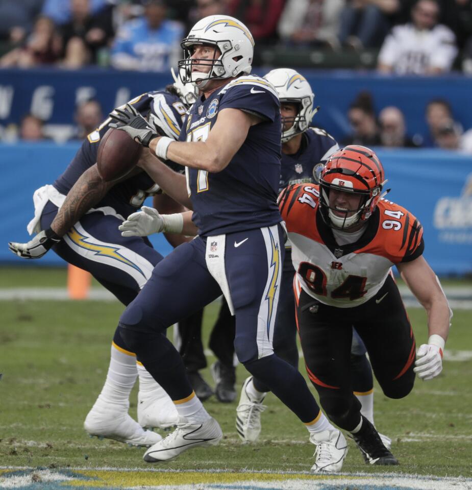 Chargers quarterback Philip Rivers can’t escape the pressure from Bengals defensive lineman Sam Hubbard and is sacked during the third quarter.