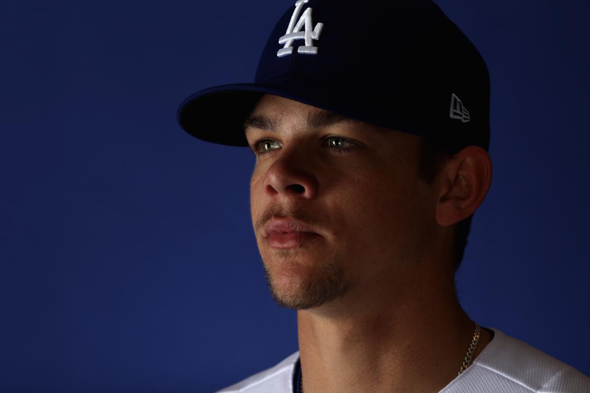 Pitcher Gavin Stone looks to the left of the camera while posing for a portrait during spring training 